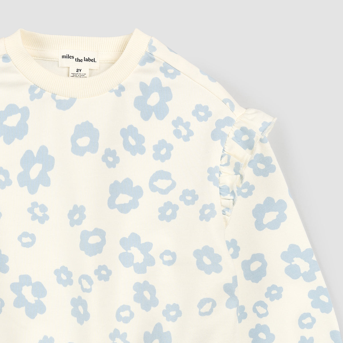 Blue Daisy Print on Off White Sweatshirt