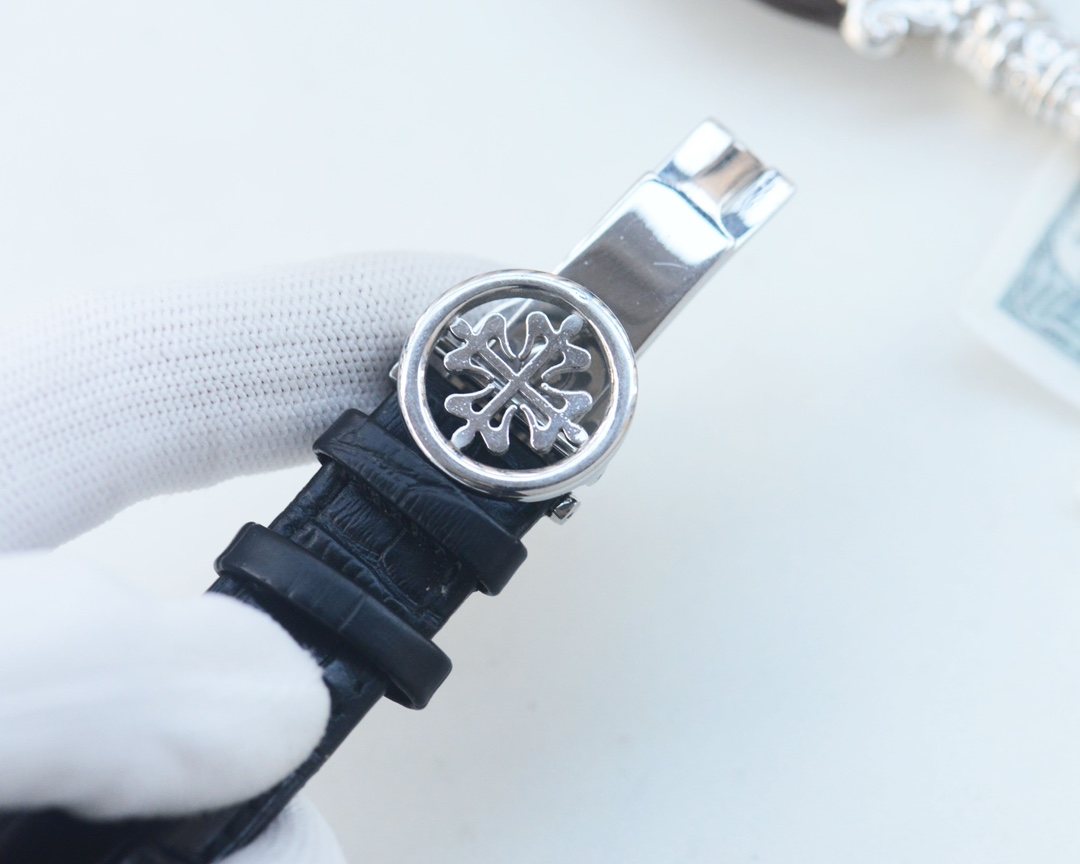 Patek Philippe Silver Black Leather Strap Watch — detail